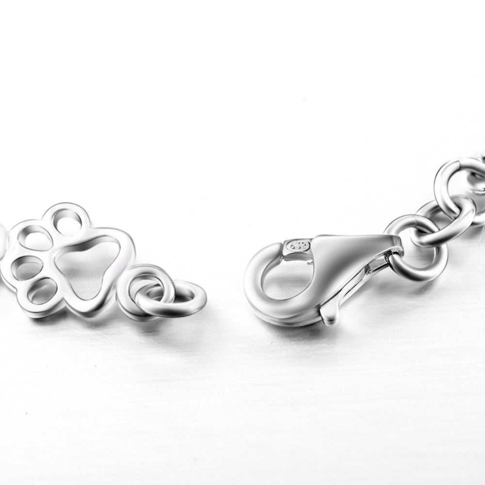 Silberarmband mit Pfotenabdruck und Knochenmotiv