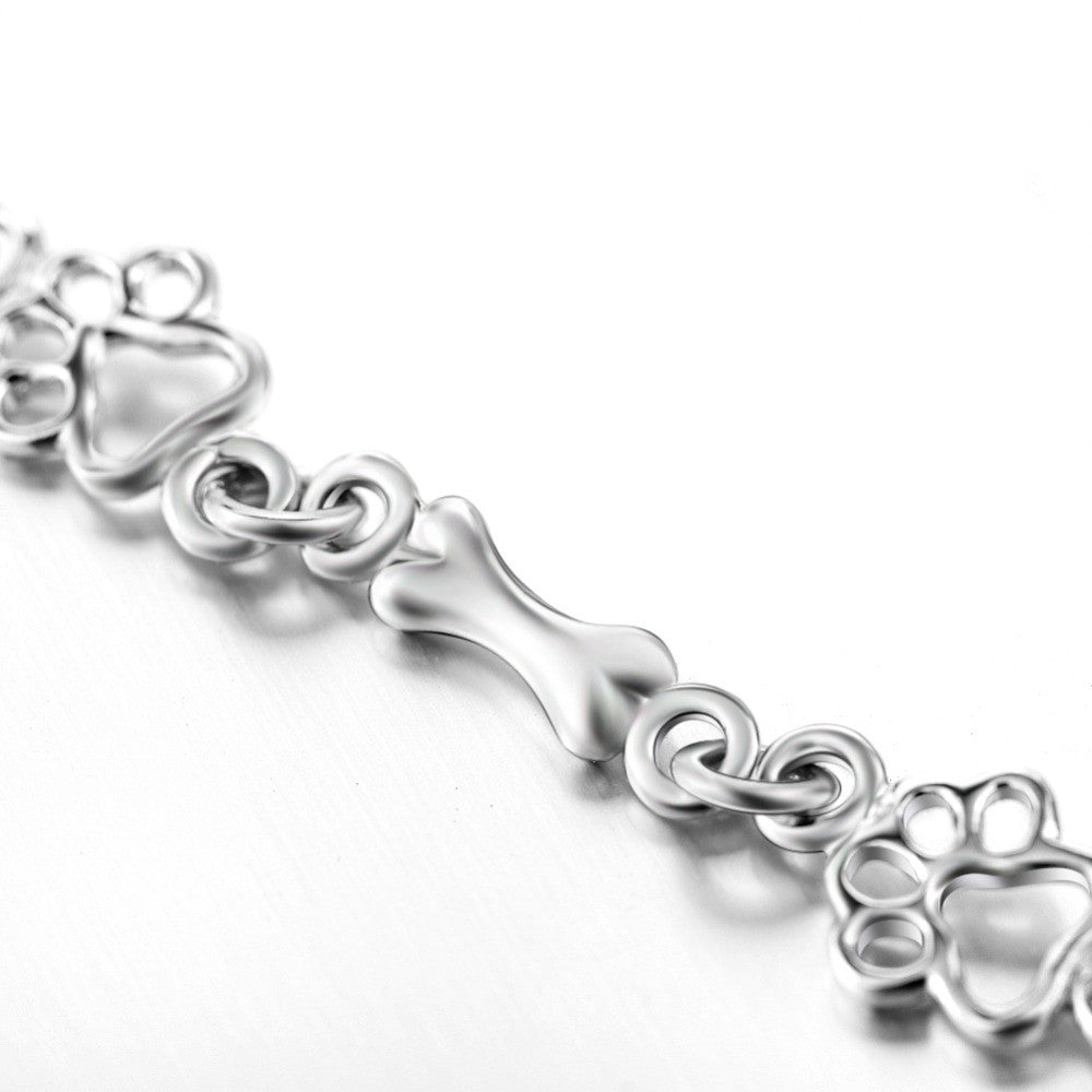 Silberarmband mit Pfotenabdruck und Knochenmotiv