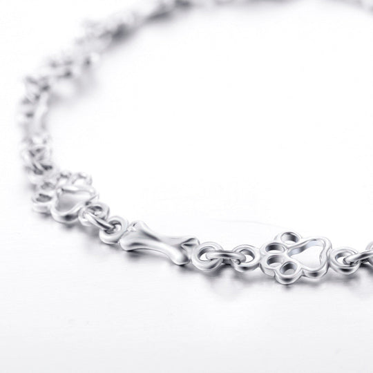 Silberarmband mit Pfotenabdruck und Knochenmotiv
